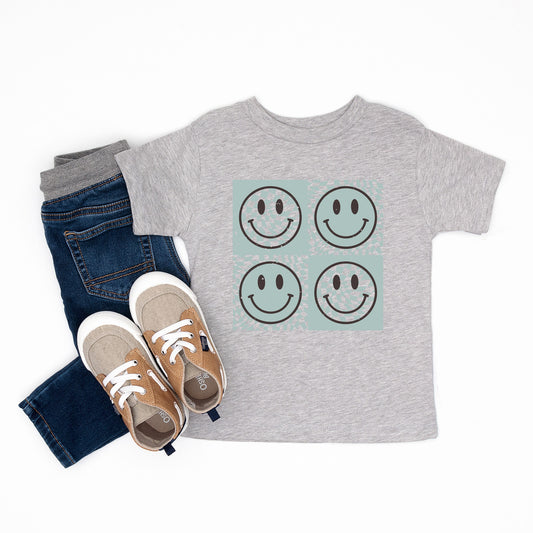 Four Checkerboard Smiley Faces | Youth Graphic Short Sleeve Tee