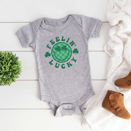 Feelin Lucky Checkered Smiley Face | Baby Graphic Short Sleeve Onesie