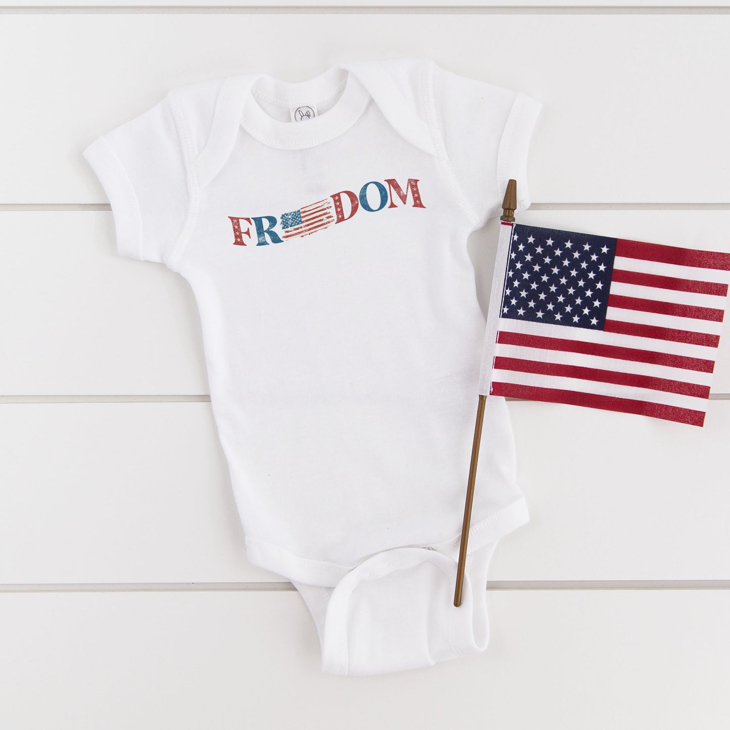 Distressed Freedom American Flag | Baby Graphic Short Sleeve Onesie