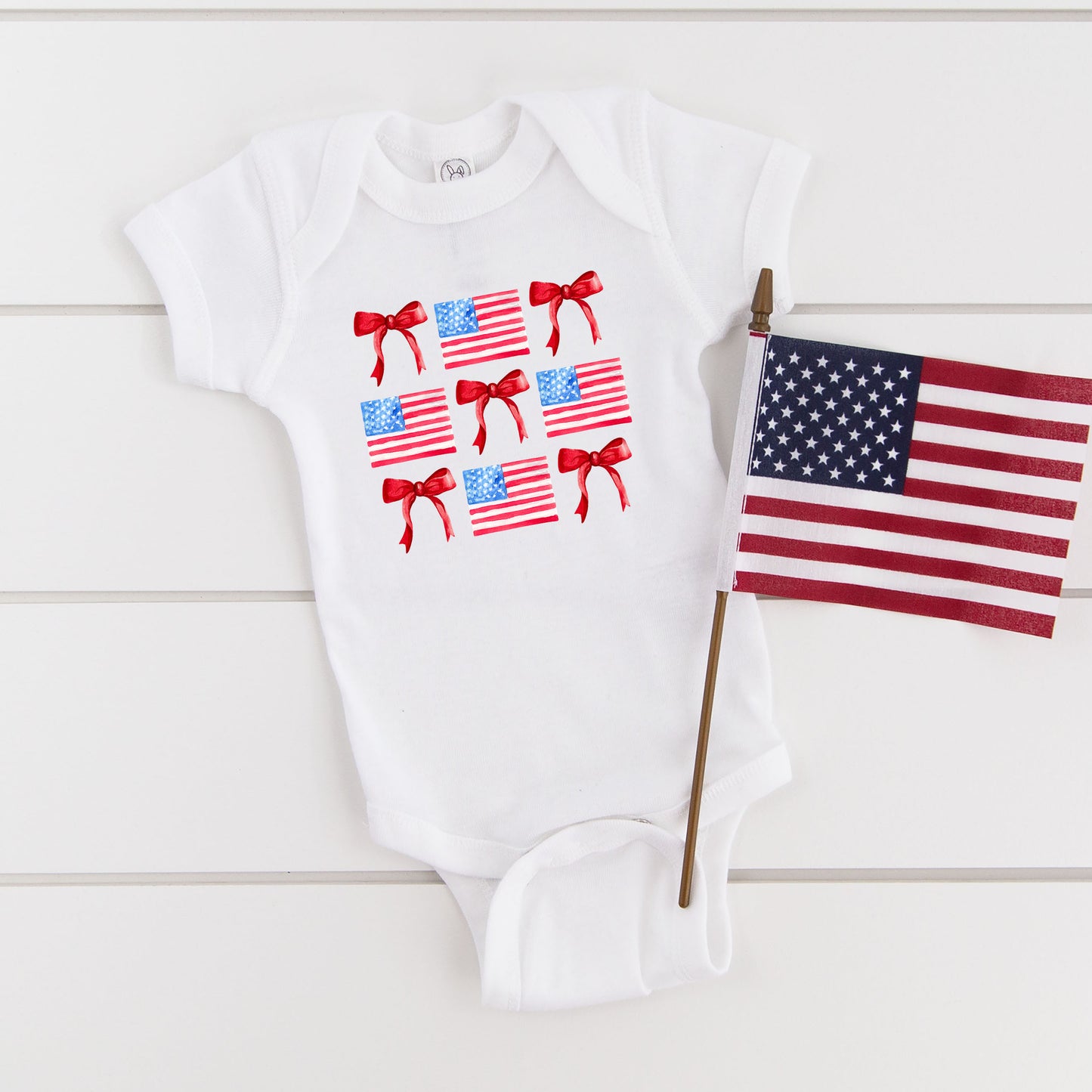 Coquette Flags Chart | Baby Graphic Short Sleeve Onesie