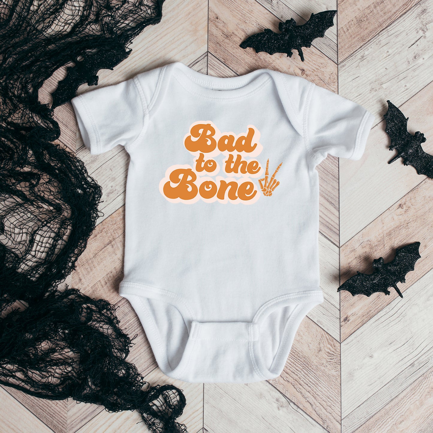 Bad To The Bone Hand | Baby Graphic Short Sleeve Onesie