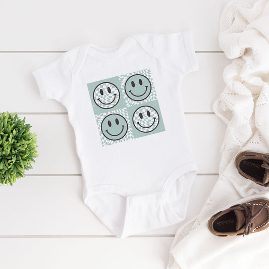 Four Checkerboard Smiley Faces | Baby Graphic Short Sleeve Onesie