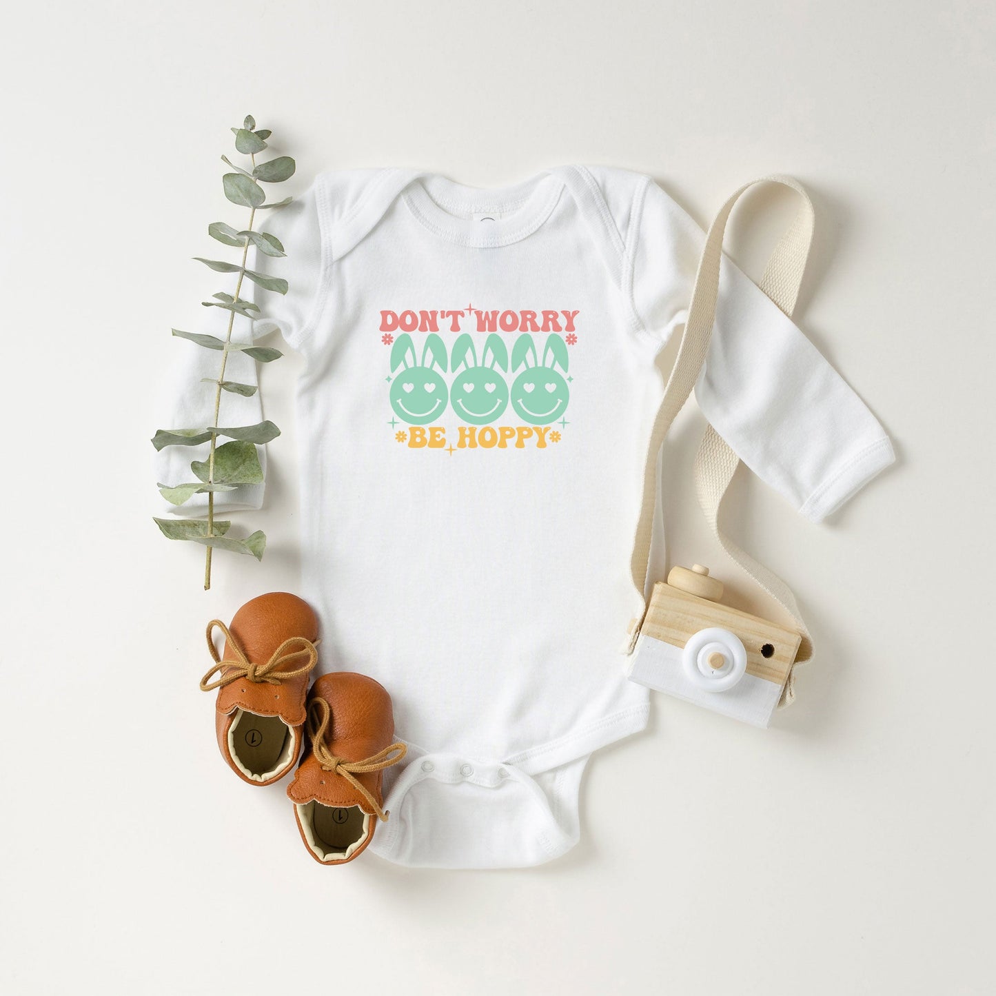 Don't Worry Be Hoppy Smiley Face With Ears | Baby Long Sleeve Onesie
